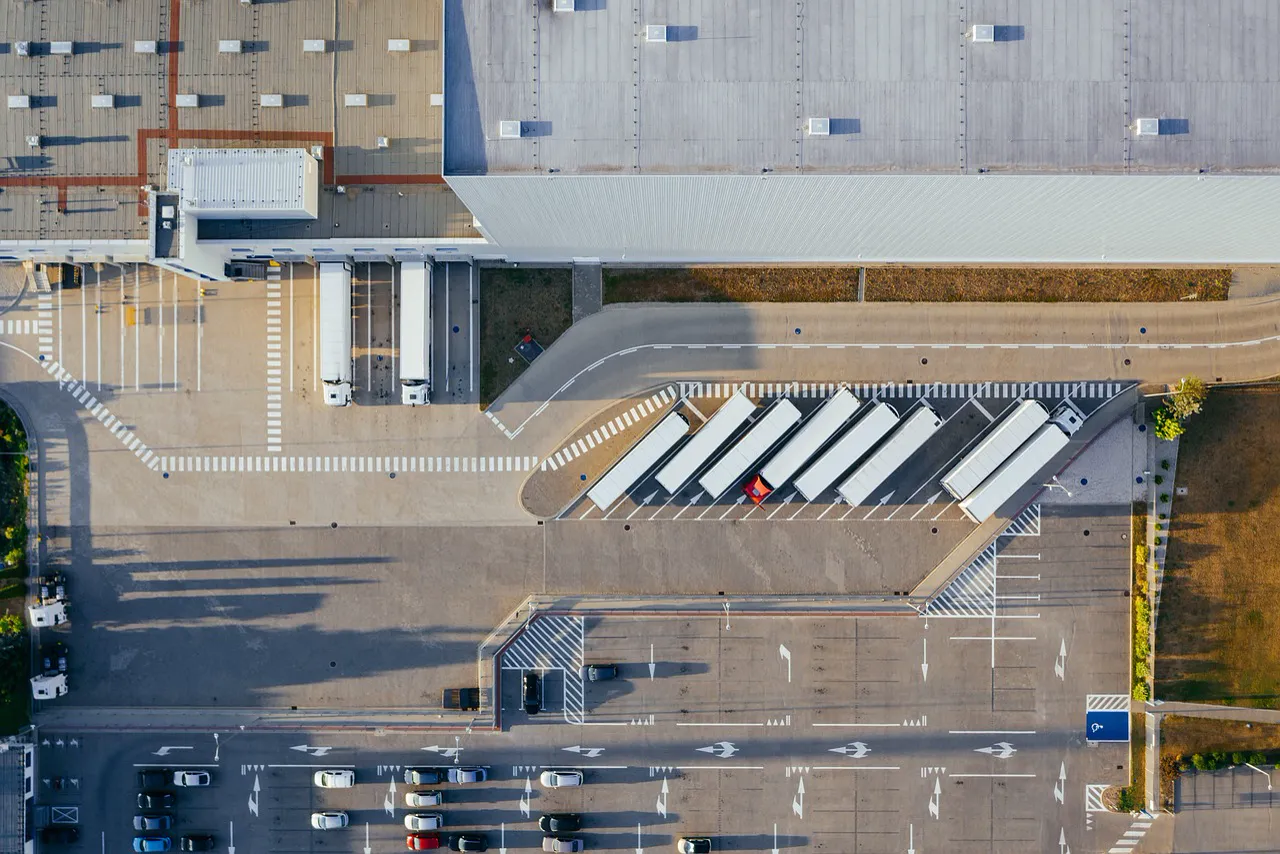 Freight being loaded into a delivery truck at a warehouse dock