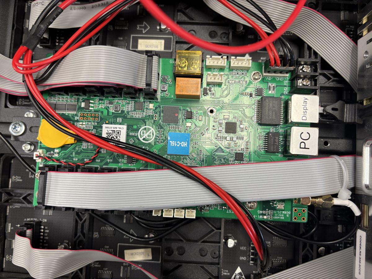 Receiver card PCB with DC power wiring and HUB ribbon data cables sharing the same cavity