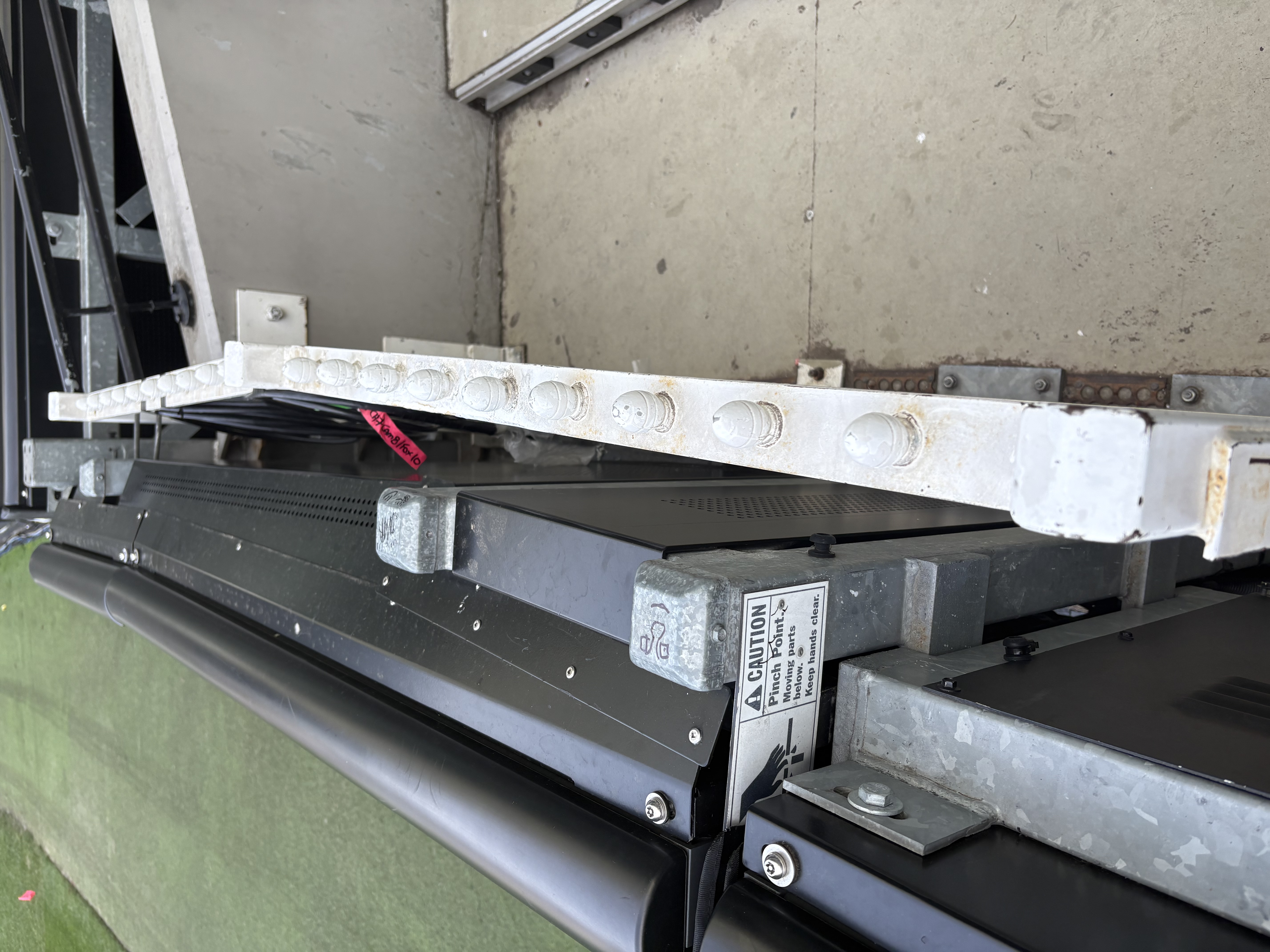 Parapet bracket system side view — engineered for 60 mm clearance behind the display face