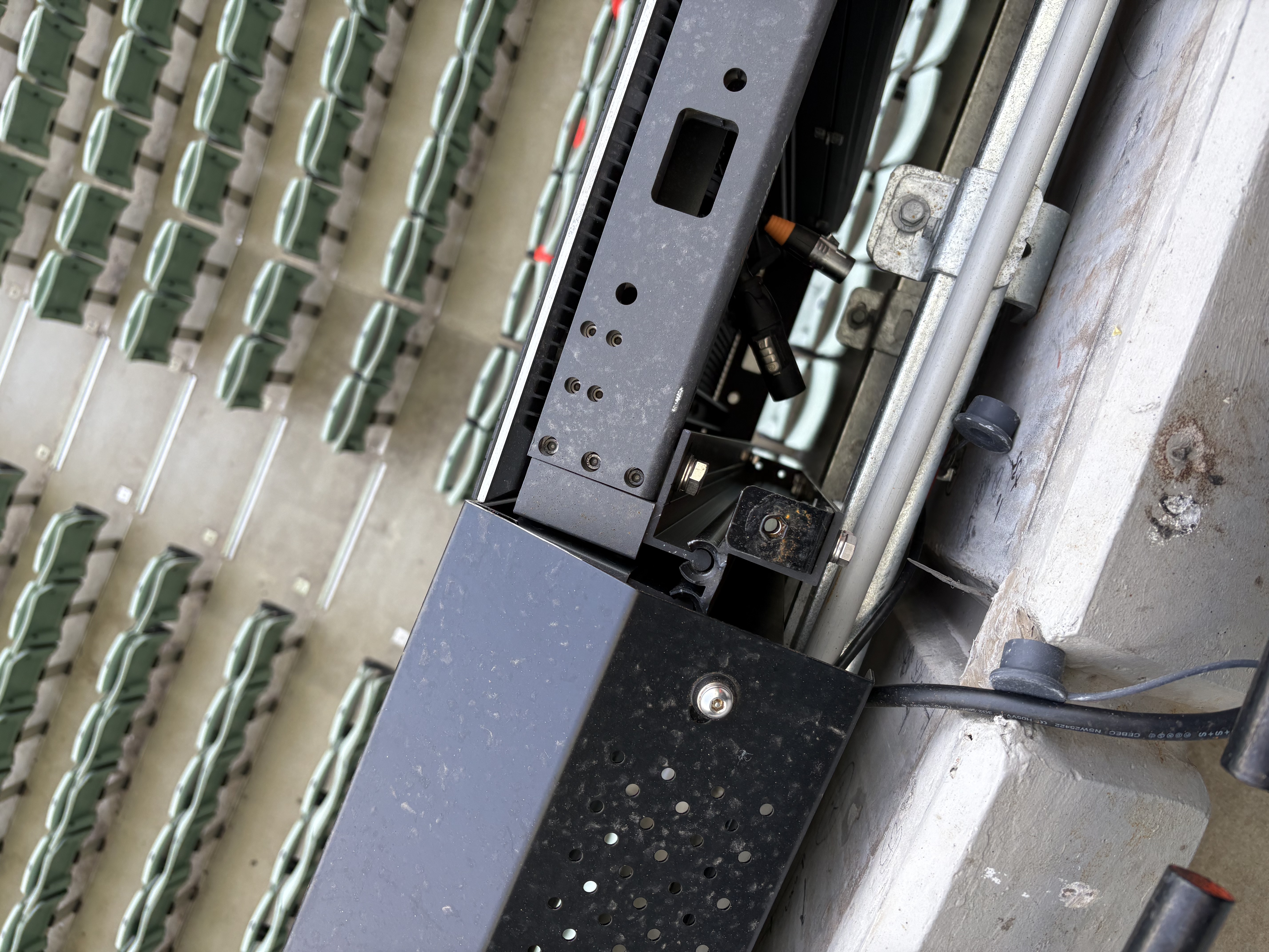 Custom slide-rail parapet bracket — rear cabinet access without front-of-parapet harness