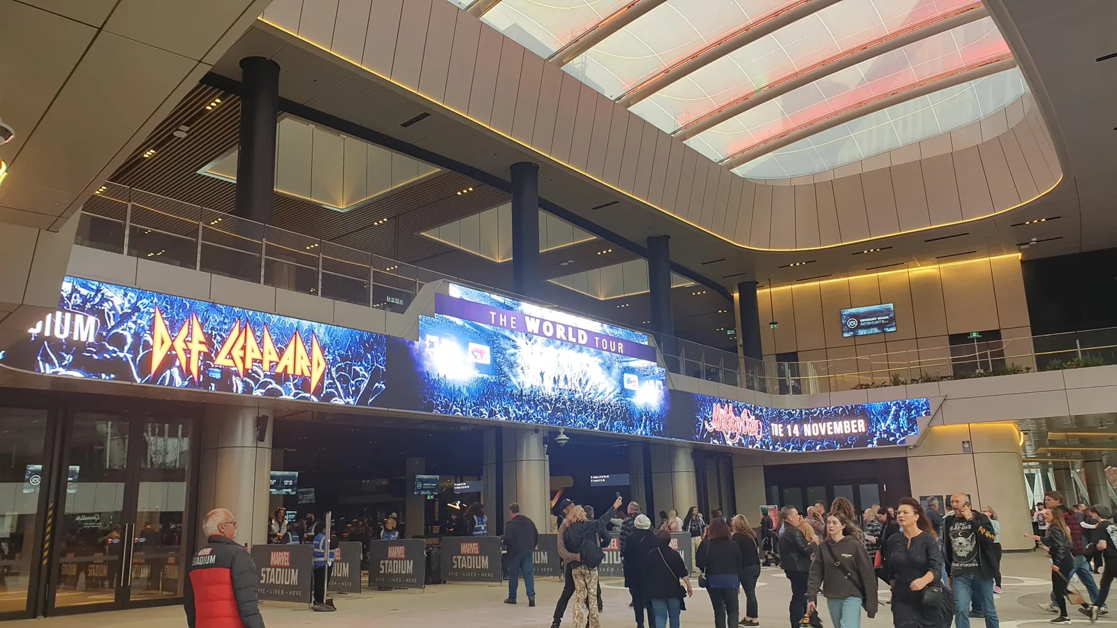Aurora LUX LED ribbon and concourse displays at Marvel Stadium showing Def Leppard ‘The World Tour’ creative above the entry foyer